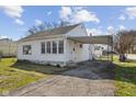 Charming single story home featuring vinyl siding, attached carport, and a neatly kept lawn at 2501 Reformers Ave, Indianapolis, IN 46203