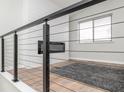 Bright living space showcasing a modern fireplace, luxury vinyl flooring, and a large window at 3153 Stillmeadow Dr, Indianapolis, IN 46214
