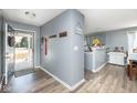 Open entryway leading to the kitchen, featuring modern flooring and neutral paint at 329 Dogwood Dr, Pendleton, IN 46064