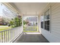 Inviting front porch with a porch swing, offering a relaxing outdoor space at 329 Dogwood Dr, Pendleton, IN 46064