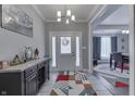 Welcoming entryway with stylish tile, a console table, and views to the dining room, creating a warm first impression at 34 David Ln, Indianapolis, IN 46227