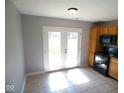 Bright eat-in kitchen area with sliding glass doors to the backyard, maximizing natural light and indoor-outdoor flow at 5523 Epperson Ct, Indianapolis, IN 46221