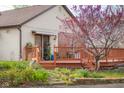 Charming home featuring a spacious wooden deck and beautiful landscaping at 6141 Madison Ave, Indianapolis, IN 46227