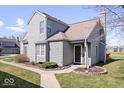 Inviting exterior showcasing the home's architectural details and landscaping at 7454 Harbour Isle # 158, Indianapolis, IN 46240