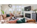 Cozy living room with fireplace and large windows, perfect for relaxation at 7454 Harbour Isle # 158, Indianapolis, IN 46240
