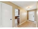 Inviting foyer with tiled floors and coat closet leading into the home's kitchen area at 7974 N 500 W, McCordsville, IN 46055