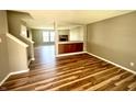 Spacious living room featuring beautiful wood floors, an open concept design, and a cozy fireplace at 8051 Retreat Ln, Indianapolis, IN 46259