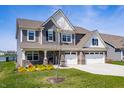 Traditional two-story home with three-car garage and beautiful landscaping at 8853 Boylan Pl, Pendleton, IN 46064