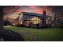 Expansive backyard with a spacious deck and large windows offering ample natural light, perfect for outdoor living at 8939 Spider Bay Ct, Indianapolis, IN 46236
