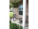 Relaxing covered front porch with rocking chairs and green landscaping at 981 Redwood Dr, Franklin, IN 46131
