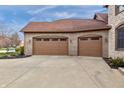 A three-car garage showcasing matching doors at 9877 Wading Crane Ave, Fishers, IN 46055