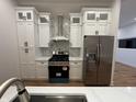 Bright kitchen with stainless steel appliances, a gas range, and white marble backsplash at 1026 St Peter St, Indianapolis, IN 46203