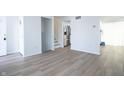 Open-concept living room with hardwood floors and staircase at 10321 Starview Dr, Indianapolis, IN 46229