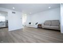 Bright and airy living room featuring hardwood floors and neutral paint at 10321 Starview Dr, Indianapolis, IN 46229