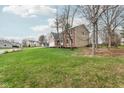 Spacious front yard view of a brick and siding home in a quiet neighborhood at 108 Wesley Cir, Noblesville, IN 46062