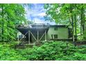 An elevated wooden deck overlooks a lush, private backyard at 2143 Sunderland Dr, Martinsville, IN 46151