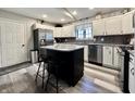 Bright kitchen with granite countertops, stainless steel appliances, kitchen island and modern finishes at 2143 Sunderland Dr, Martinsville, IN 46151