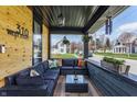Inviting covered porch with comfortable seating, perfect for relaxing outdoors at 310 W Staat St, Fortville, IN 46040