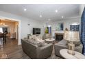 Bright living room featuring a fireplace, couches, and a flat screen TV with an open floor plan at 3636 N Chester Ave, Indianapolis, IN 46218