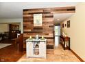 Welcoming entryway with hardwood accents, charming decor, and a view into the rest of the home at 381 Stoneybrook Grove Dr, Greenwood, IN 46142