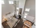 Bright, two-story living room with fireplace, tall windows, and an open floor plan at 445 W 86Th St, Indianapolis, IN 46260