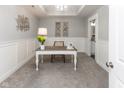Cozy home office space with neutral carpet, wainscoting and a decorative desk, perfect for remote work at 445 W 86Th St, Indianapolis, IN 46260