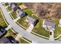 Aerial view of a residential neighborhood showcasing well-maintained homes with lush green lawns at 4846 Shakamak Ct, Indianapolis, IN 46239