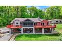 Beautiful two-story home with a large deck overlooking the landscaped backyard and hot tub at 5571 Poff Rd, Martinsville, IN 46151