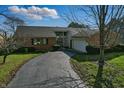Charming single-Gathering home with brick facade and driveway leading to the attached garage at 6140 Buttonwood Dr, Noblesville, IN 46062
