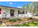 Charming home with a well-manicured garden bed and inviting front porch at 720 Danielle Rd, Lebanon, IN 46052