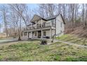 Beautiful two-story house featuring a fire pit and outdoor area for relaxation and enjoyment at 7980 S State Road 135, Columbus, IN 47201