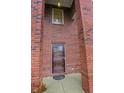 Close-up of the home's front door, framed by brick columns and a window above at 8744 N Aspen Way, McCordsville, IN 46055