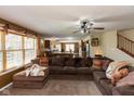 Comfortable living room with a large sectional sofa, and an open view to the kitchen at 1083 Sugar Maple Dr, Greenwood, IN 46143