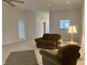 Comfortable living room featuring neutral carpeting, and recessed lighting, creating an inviting atmosphere at 10949 Harness Way, Indianapolis, IN 46239
