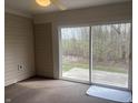 Cozy sunroom featuring sliding glass doors with view of the backyard at 10949 Harness Way, Indianapolis, IN 46239