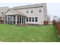 Expansive backyard features a screened-in porch, perfect for relaxing and enjoying the outdoors at 11149 Titania Ct, Noblesville, IN 46060