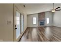 Spacious living room featuring hardwood floors and a cozy brick fireplace at 12334 Buckley Blvd, Indianapolis, IN 46229