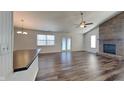 Bright living room with hardwood floors and a brick fireplace, perfect for entertaining at 12334 Buckley Blvd, Indianapolis, IN 46229