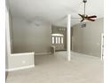 Spacious living room featuring neutral walls, carpeted flooring, and plenty of natural light at 1238 Passage Way, Plainfield, IN 46168