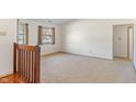 Bright bedroom with neutral carpet, large window, and natural light at 130 Briarwood Ct, Brownsburg, IN 46112