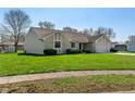 Well-maintained single-story home with stone details and green grass at 130 Briarwood Ct, Brownsburg, IN 46112