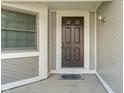 Welcoming front door with sidelight and neutral trim, creating a warm entrance at 130 Briarwood Ct, Brownsburg, IN 46112