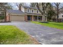 Attractive home featuring brick accents and a spacious driveway at 1320 Bittersweet Dr, Greenfield, IN 46140