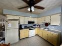 Functional kitchen with painted cabinetry, complete with standard appliances and ample counter space at 1706 Manor Dr, Lebanon, IN 46052