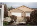 Charming home exterior with two white benches, lush landscaping, and inviting curb appeal at 172 Arabian Ct, Whiteland, IN 46184
