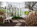 Beautiful garden featuring white benches, stepping stone pathway, and a variety of blooming flowers at 172 Arabian Ct, Whiteland, IN 46184