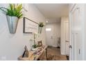 Bright and welcoming entryway with modern decor, light wood floors, and white trim at 181 Kiawah Dr, Whiteland, IN 46184