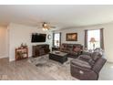 Cozy living room with a modern ceiling fan, a large TV, and comfortable seating at 181 Kiawah Dr, Whiteland, IN 46184