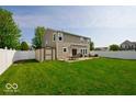 Spacious backyard featuring a well-maintained lawn, a storage shed, and an outdoor dining set at 2009 Quarter Path Rd, Cicero, IN 46034