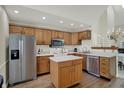 Spacious kitchen with stainless steel appliances, a center island, and plenty of cabinet space at 36 Palomino Ct, Zionsville, IN 46077
